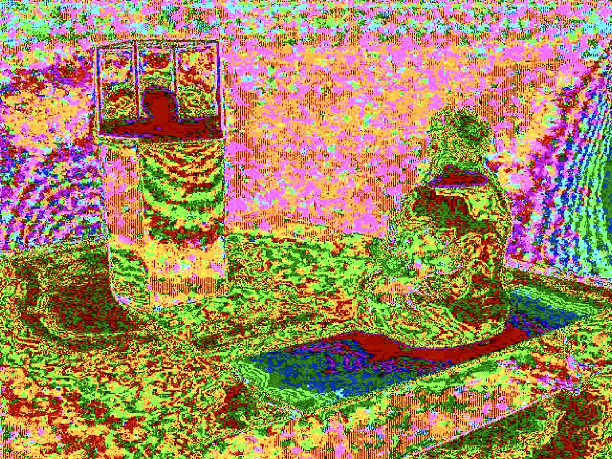 Pixelated pink and green tabletop scene with dark central forms